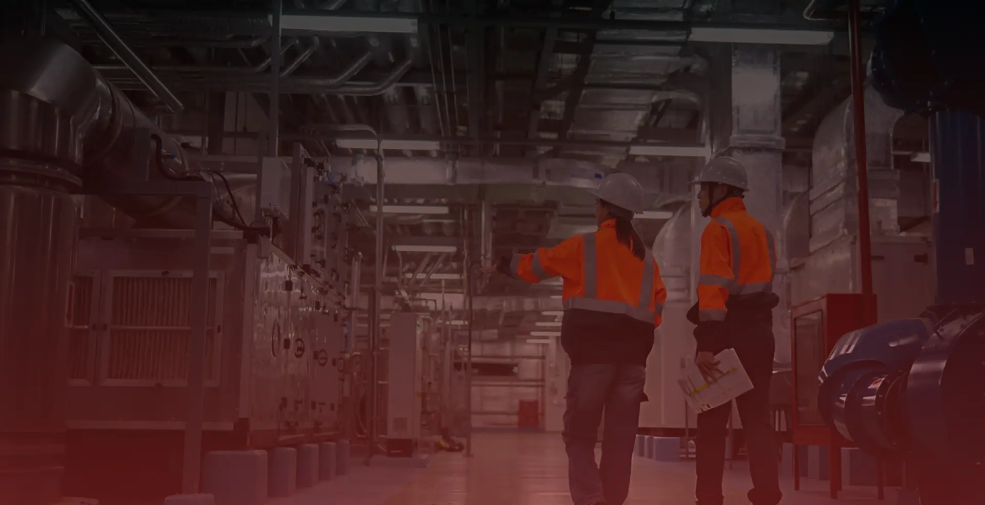 Worker walking through a modern manufacturing facility